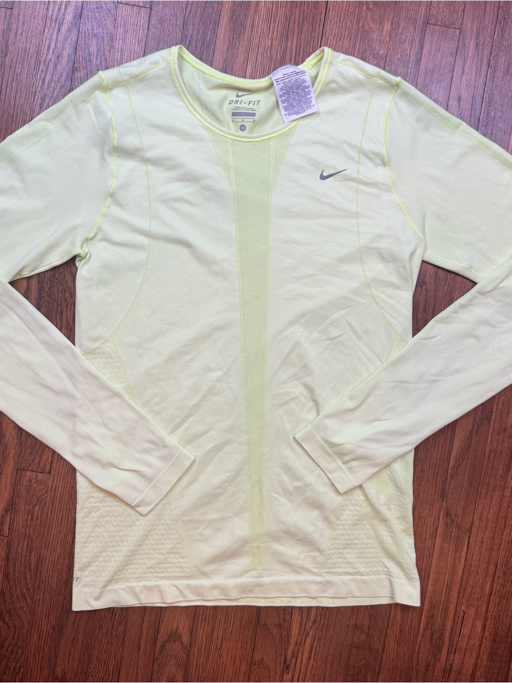 Nike Women’s Medium Long Sleeve Dri-FIT Top in Yellow
